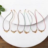 Short red beaded necklace